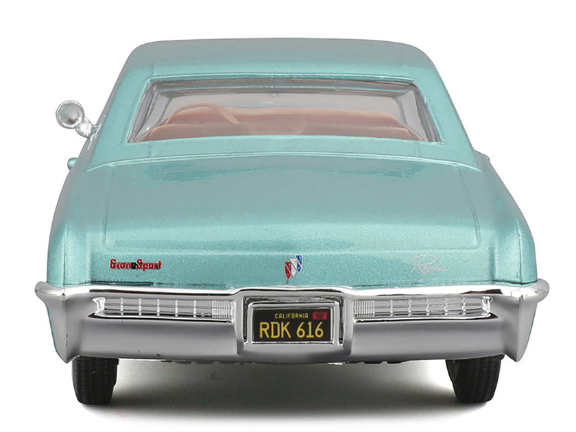 Maisto 1965 Buick Riviera Gran Sport Modellauto Lichtblaumetallic 1/26 4