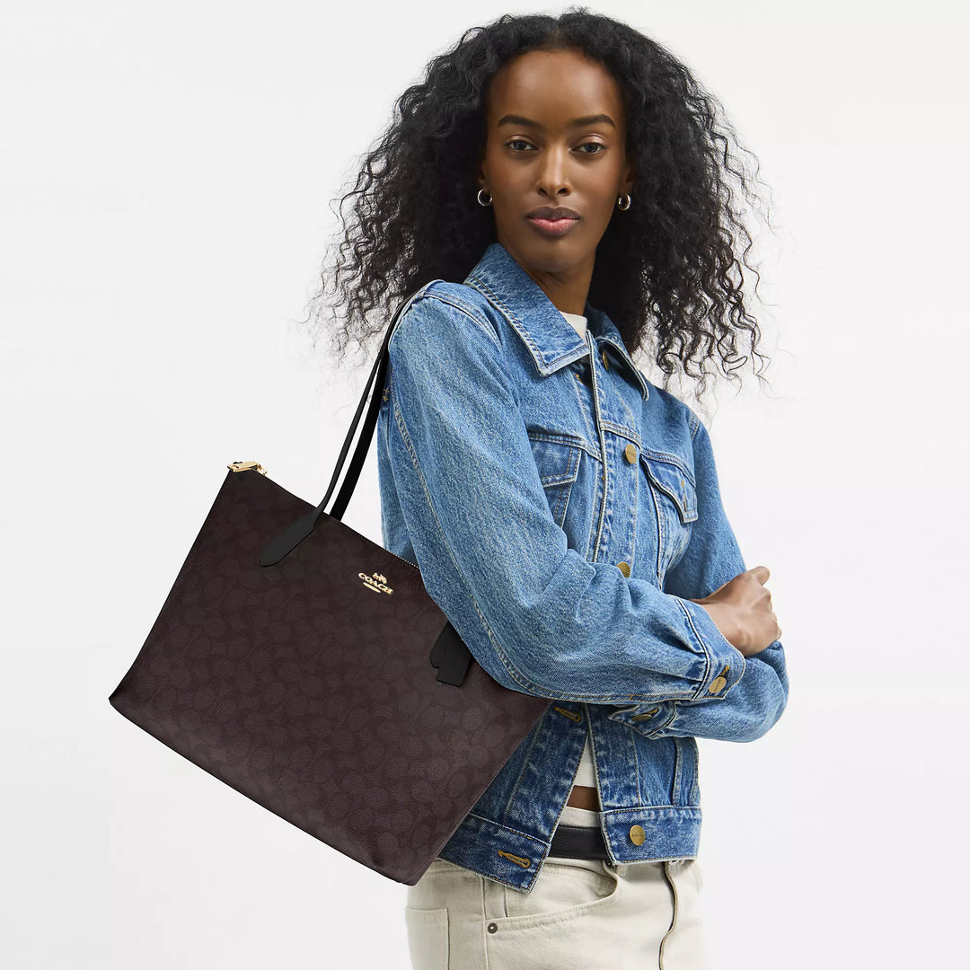 Coach Outlet Zip Top Tote Bag In Signature Canvas | ShopSimon