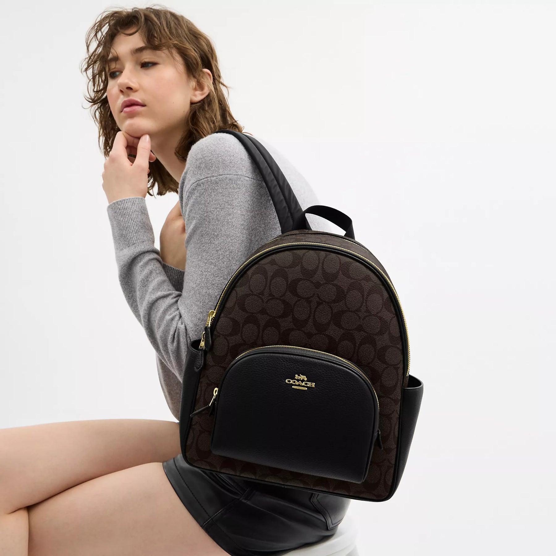 coach court backpack in blocked signature canvas in Chalk/Glacier Whit  Signature coated canvas and refined pebble leather Inside zip and multifunction pockets Double zip closure fabric lining Handle with 2 1/4 drop Outside zip pocket Adjustable shoulder straps 10 3/4 (L) x 12 1/2 (H) x 4 3/4 (W) Style No. NWT Coach Court Backpack In