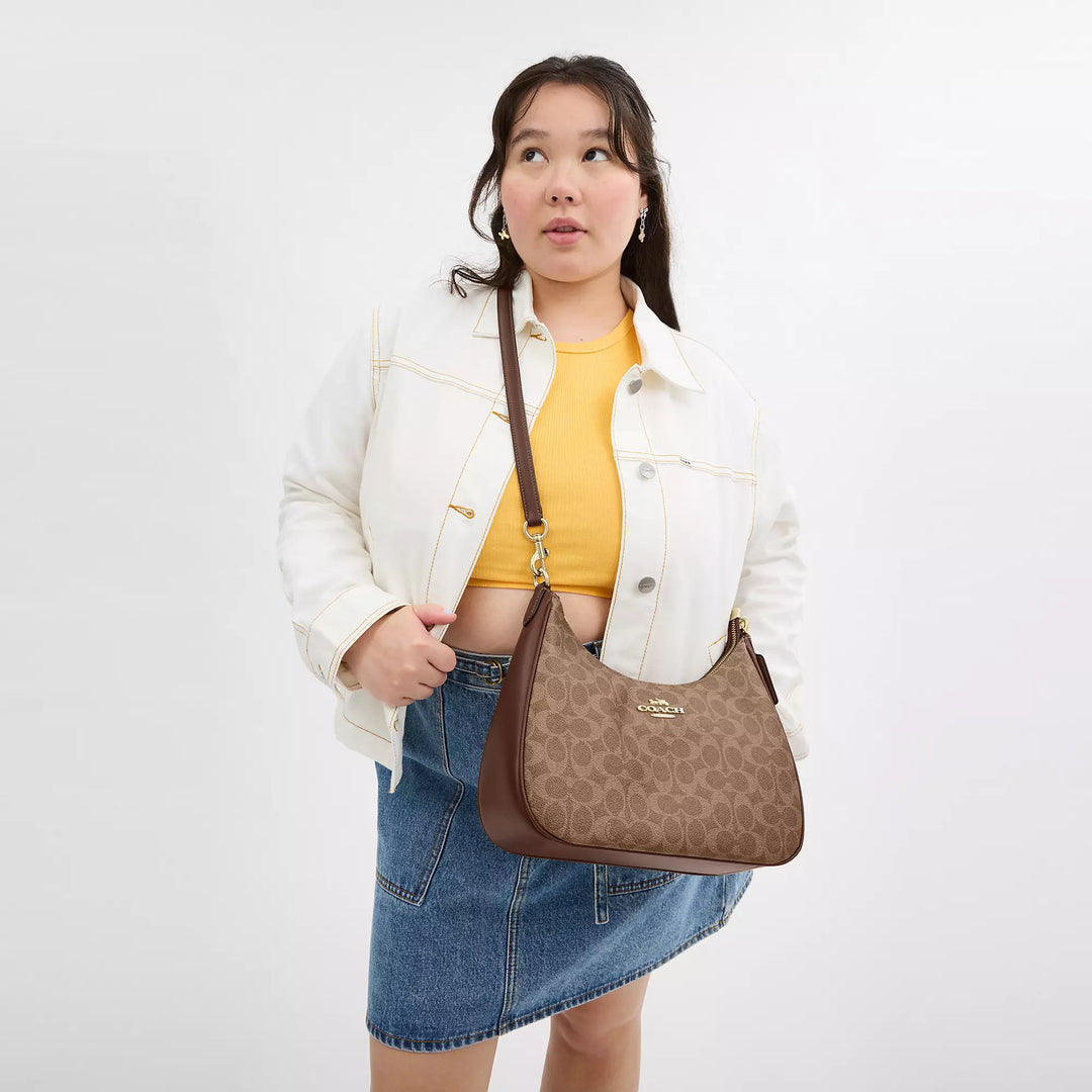 Coach Outlet Teri Hobo Bag In Signature Canvas | ShopSimon